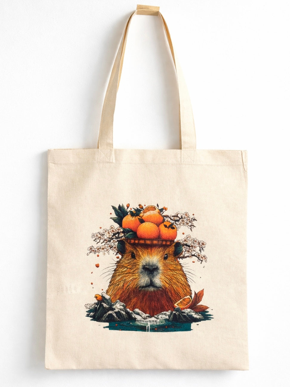 Natural cotton canvas tote bag with Japanese capybara onsen illustration, citrus and sakura design, product photo on white background.