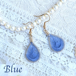 One color mandala design threaded earrings.