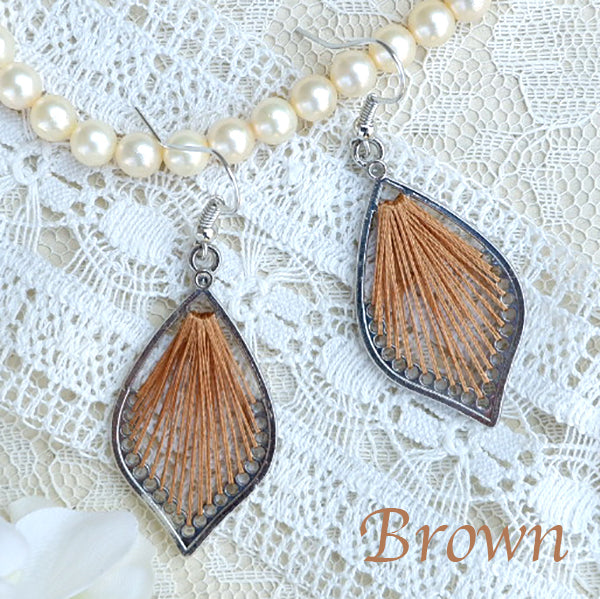 One color mandala design threaded earrings.