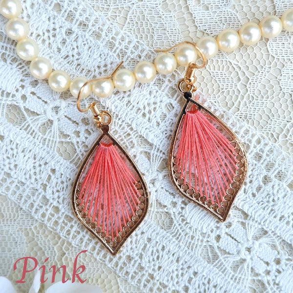 One color mandala design threaded earrings.